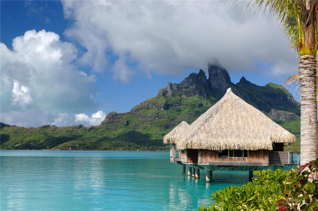 8)The St. Regis Bora Bora ResortOver water villa with backdrop of Mt. Otemanu Ĕz.jpg